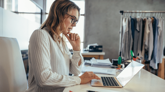 Woman filing taxes for her online fashion business