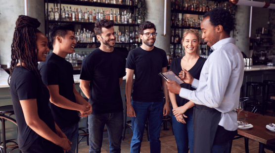What is a form 19 Business owner conducting a team meeting with their new hires.