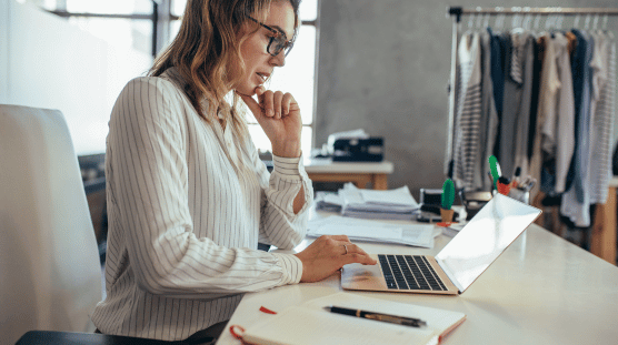 Incredible Benefits of Employee Self-Service Tools Woman working on her laptop at a coffee shop