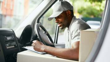 Common Small Business Terms and Abbreviations Delivery driver checking off his to-do list.