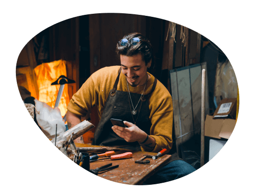 Man smiling looking at phone