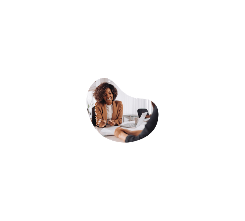 Woman smiling at papers on a desk