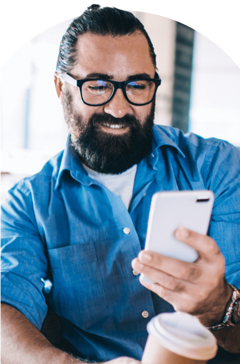 Person smiling at phone