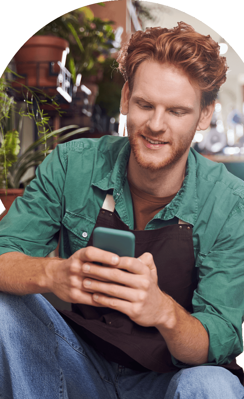 Man smiling at phone